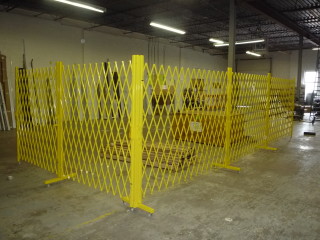 safety yellow security gates guarding industrial spaces