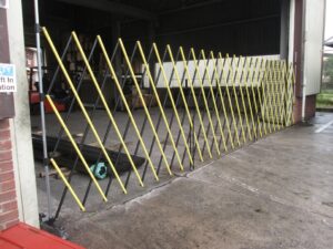 yellow and black long portable barrier